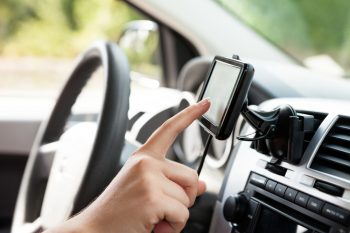 Female finger typing on gps.
